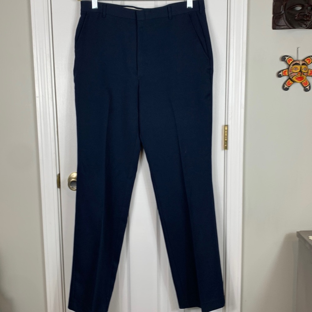 Navy blue men’s dress pants. Waist 16.5” made in USA. Inseam 32”. Pockets